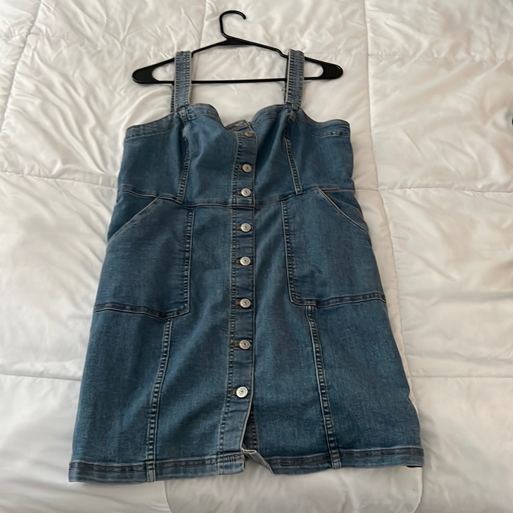 Denim, large sized, mid length H&M dress with bottoms and pockets.